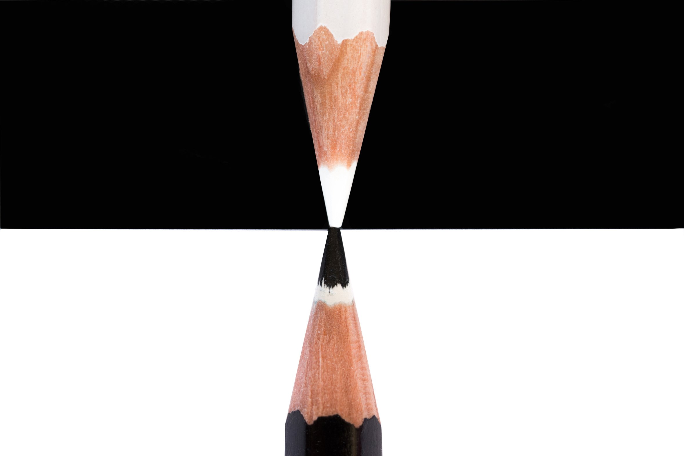 white and black pencils Opposites